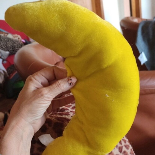 Crescent moon stuffed toy used with big smile