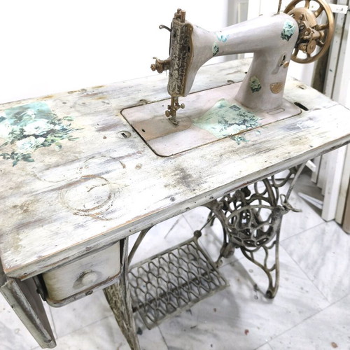 Singer sewing machine decorated with decoupage and aging, used