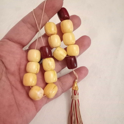 Worry beads with synthetic resin beads in yellow and burgundy, like new