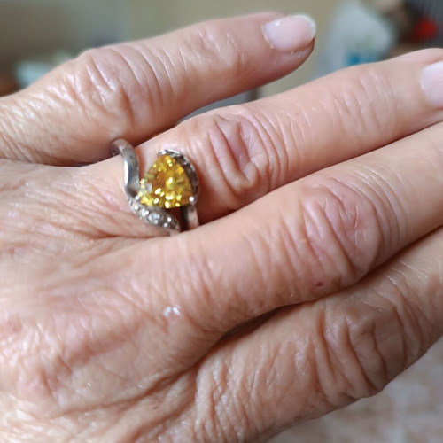 Silver ring like new with yellow stone, adjustable