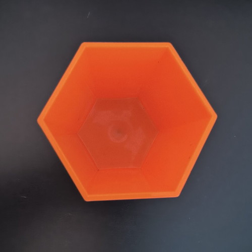 Hexagonal orange pencil holder like new, plastic