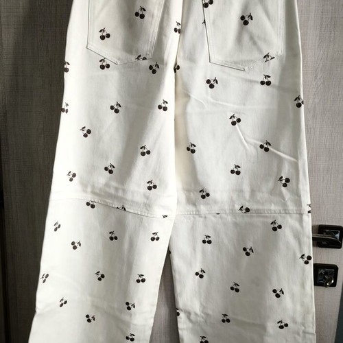 Arpyes jeans new with cherry design, size large, white and brown