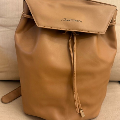 Axel beige backpack like new with missing decorative cord