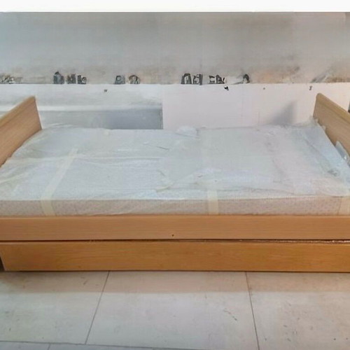 Bed with sliding second bed and mattresses like new