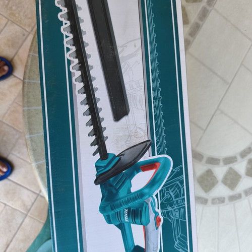 Total cordless hedge trimmer with battery and charger