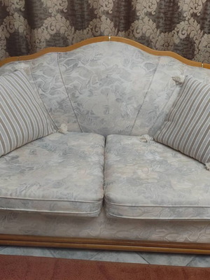 Two-seater sofa used with wood upholstery