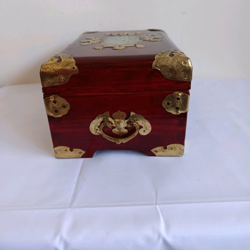 Wooden jewelry box used with brass decorative elements