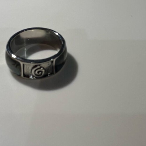 Steel ring with inlaid abalone shell details