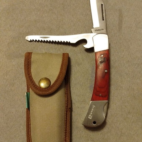 Pocket knife with blade, saw and opener like new