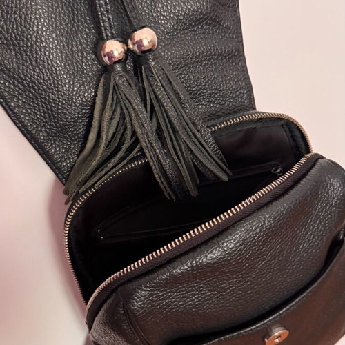 Leather backpack black like new with zipper pockets and magnetic clasp