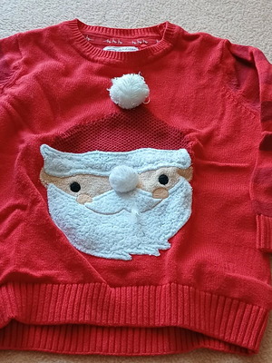 Cotton Christmas sweater used with stain on sleeve