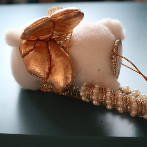 Christmas teddy bear like new with golden caramel and feathers