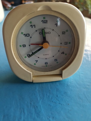 Casio portable alarm clock used, analog display