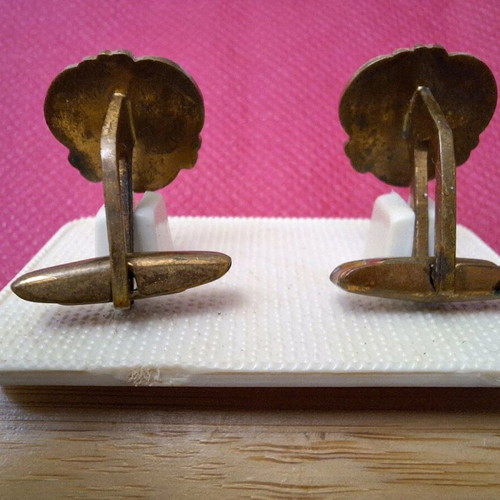 Vintage cufflinks used with black heraldic lion and gold metal