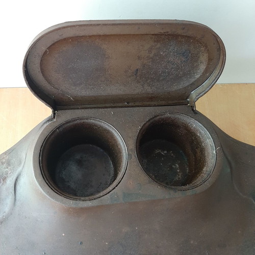 Vintage metal inkwell with ink bottle used