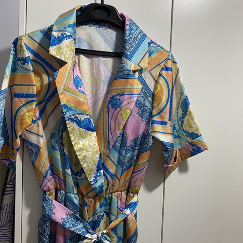 Printed jumpsuit like new with belt at waist, short sleeves, size M