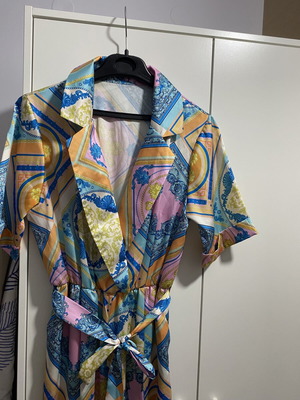 Printed jumpsuit like new with belt at waist, short sleeves, size M