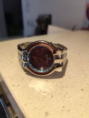 Women's watch used with purple dial and silver bracelet