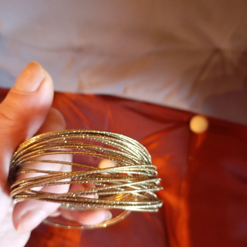 Bracelet made of 32 thin metal pieces like new, gold tone