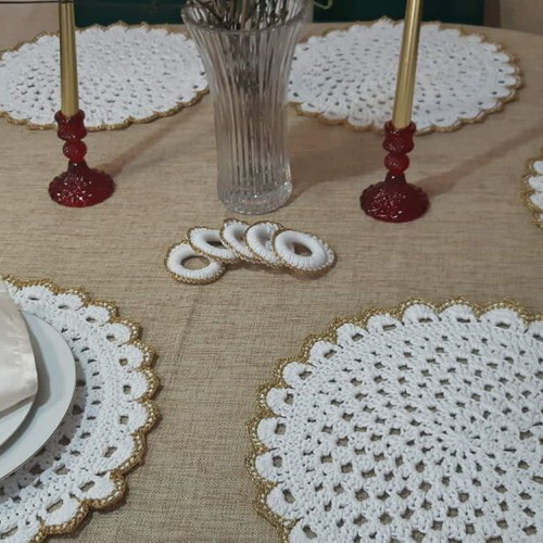 Elegant handmade white table set with gold details and napkin rings