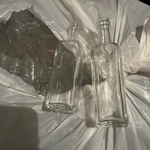 Bottles and jars new with lids and hand bottling system