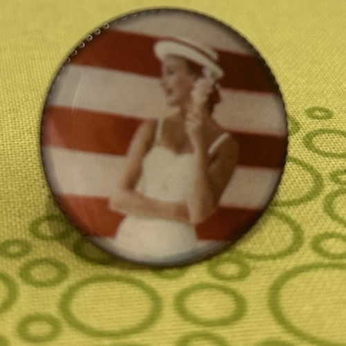 Ring used with printed woman in swimsuit design