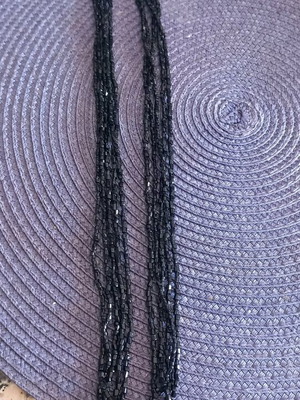 Necklace with four rows of shiny beads