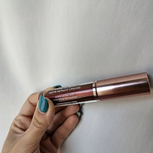 Liquid matte metallic lipstick used, dark brown