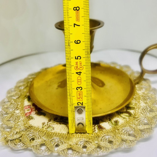Vintage brass candlestick with handle and drip plate, used
