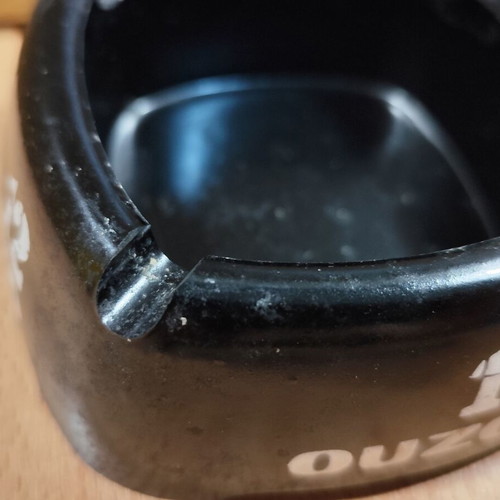 Ouzo 12 square black plastic ashtray used
