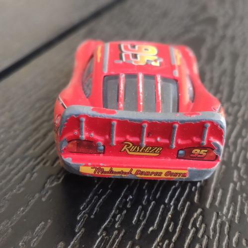 Disney Cars McQueen 1/55 toy car used with 3D eyes in fair condition