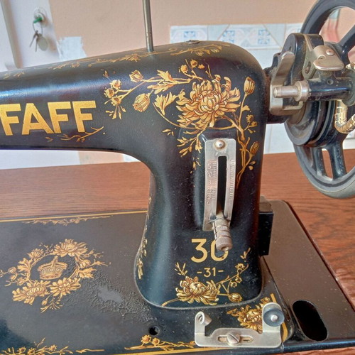 Antique sewing machine used with furniture and accessories
