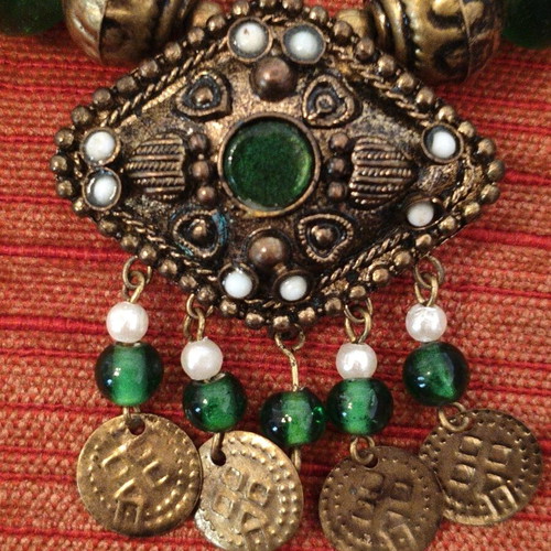 Handmade traditional vintage necklace with green beads and bronze details