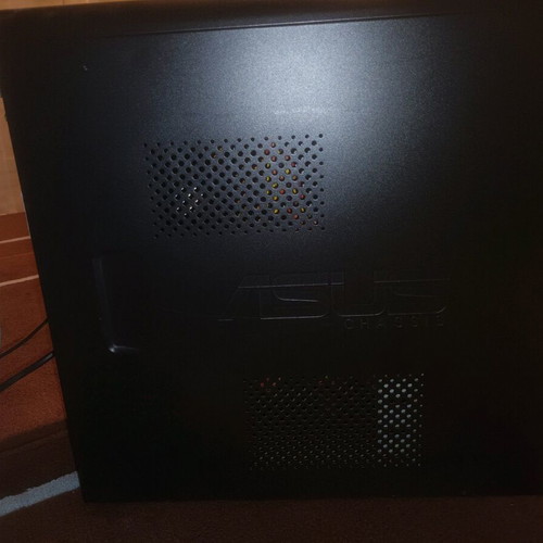 Asus computer tower used with stand and keyboard