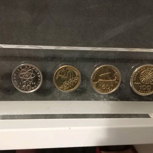 Drachmas in plexiglass new, 22x7cm