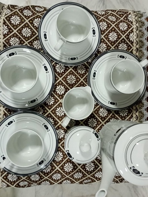 Ionia tea set with black border like new