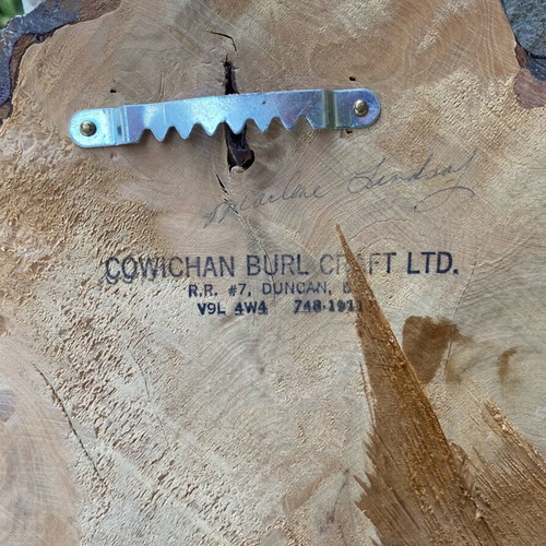Handmade wooden wall clock from tree trunk.