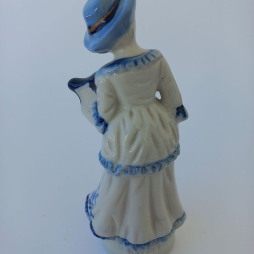 Porcelain figurine with girl musician like new