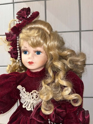 Porcelain doll Victorian style with burgundy velvet dress like new