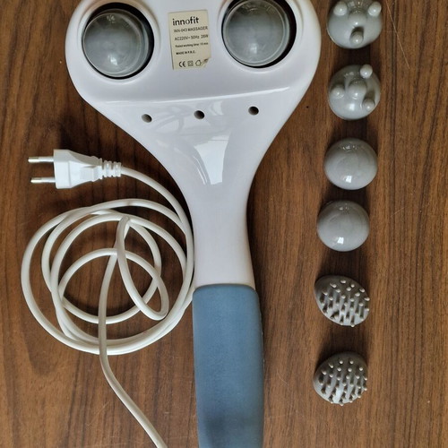 Innofit Hand Massager used with three interchangeable heads