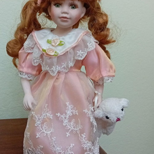 Porcelain doll like new, height 32cm