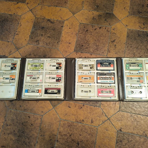 Leather case for cassettes used, with cassettes included