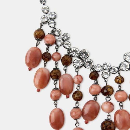 Waterfall style necklace with applique jewelry and colored stones