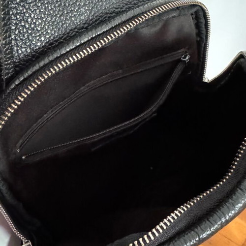 Leather backpack black like new with zipper pockets and magnetic clasp