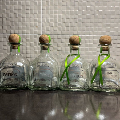 Patron champagne bucket like new with 4 empty silver bottles