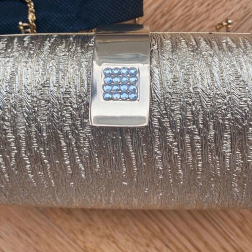 Gold clutch bag with chain strap