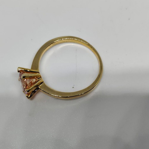 Ring with yellow gold finish and champagne stone, like new