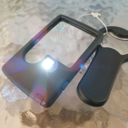 Magnifying glass with LED and opener new unused