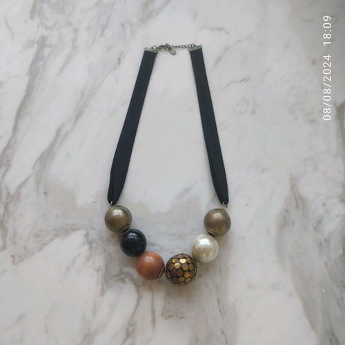 Accessorize necklace used with black thick ribbon and large beads