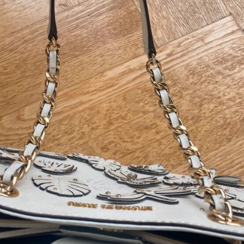 Michael Kors white tote bag with floral and dragonfly details